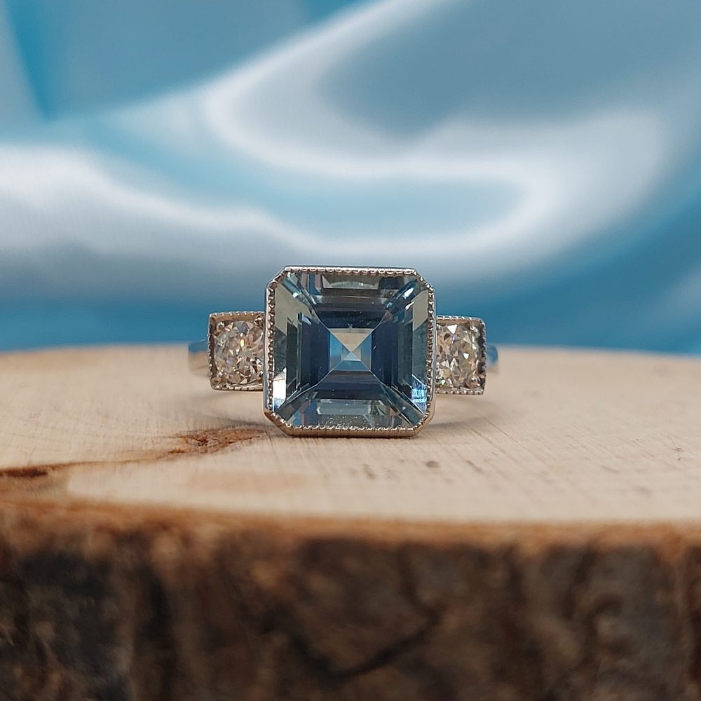 3ct Octagonal Cut Aquamarine and Diamond Three Stone Ring in Platinum