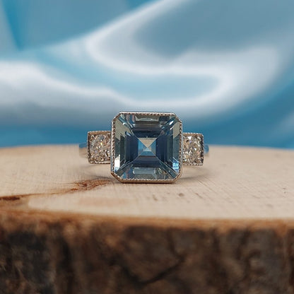 3ct Octagonal Cut Aquamarine and Diamond Three Stone Ring in Platinum