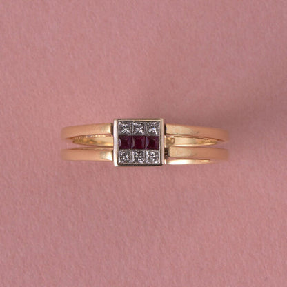 Vintage Princess Cut Diamond Reversible Ring with Sapphires or Rubies; once side set with six princess-cut sapphires in two rows flanking a line of princess-cut diamonds in the middle, the other side set with six-princess cut diamonds in two rows flanking a line of princess-cut rubies, in 18ct gold, Italy, Circa 1980
