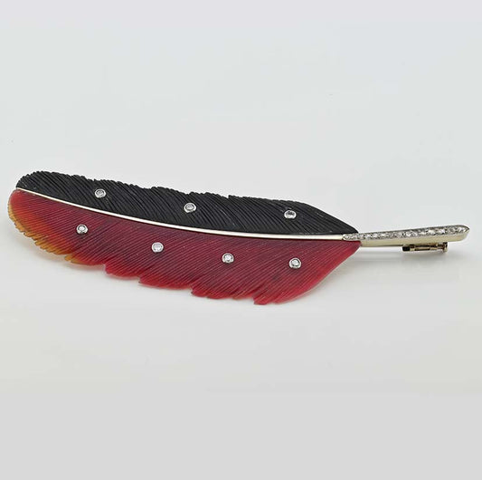 Art Deco Paltscho Vienna Red Chalcedony Black Onyx and Diamond Feather Brooch, carved red chalcedony and black onyx feather with diamond dots and rose-cut diamonds along the stem in 14ct white gold. Circa 1920. With Austro Hungarian marks of the period - Signed Ges. Gesh. (copyright) E. PALTSCHO – WIEN – KARLSBAD N. 29