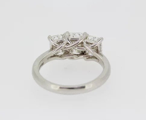 Emerald Cut 2.46ct Diamond Three Stone Ring in Platinum; a striking trilogy ring featuring three emerald-cut diamonds, 2.46 carats, Colour 'H', Clarity 'VS'