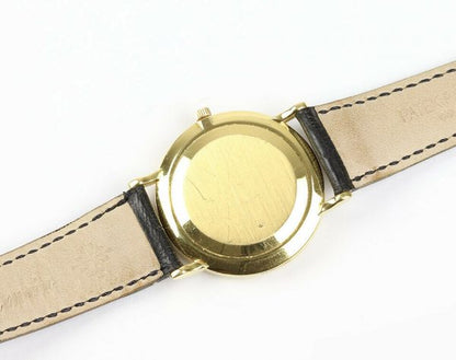 Patek Philippe Calatrava 18ct Yellow Gold 33mm Watch, 3919, porcelain white dial, Roman numerals, seconds sub-dial at 6, manual movement. With Patek Philippe strap, pouch and extract.