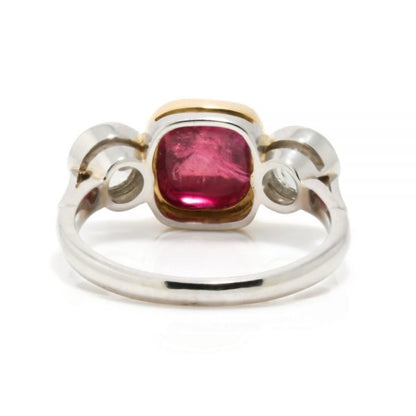 Art Deco Natural Cabochon Ruby and Diamond Trilogy Ring; central 4.52ct cabochon-cut natural ruby flanked by 1cts old-cut diamonds, in 18ct yellow gold and platinum, Circa 1920, with GCS certificate