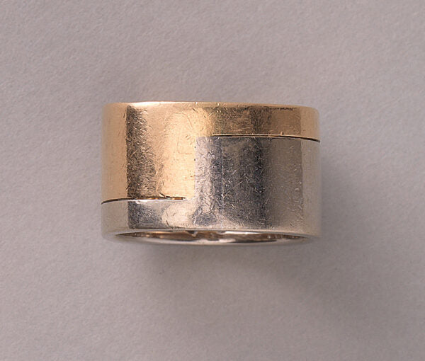 Vintage Diamond and Bi Colour 18ct Gold Band Ring; 18ct yellow and white gold juxtaposed angle pavé set with 48 brilliant cut diamonds, 2.50 carat total, by the Swiss master jeweller Paul Binder. Circa 1970s, Zurich, Switzerland