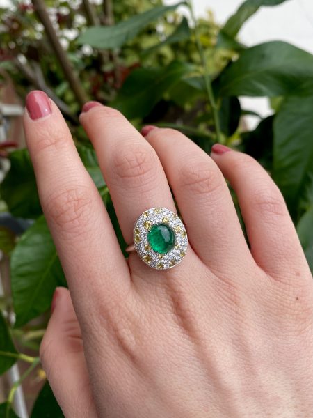 Cabochon Emerald and Diamond Cluster Ring in Platinum; 3.62ct cabochon-cut emerald with no oil within an oval white diamond and yellow sapphire surround