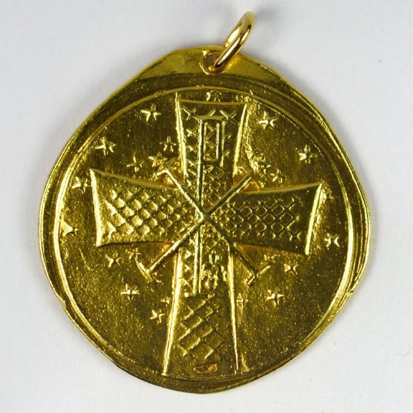 Virgin of the Lilies 18ct Yellow Gold Pendant; designed as a medal depicting the Madonna and Child with lilies, with cross on reverse