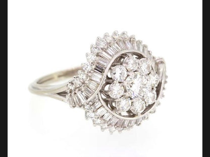 Vintage Diamond Cocktail Ring, c.1960's; set with round brilliant and baguette cut diamonds. Central floral cluster with double crossover. Est 3.50 ct total