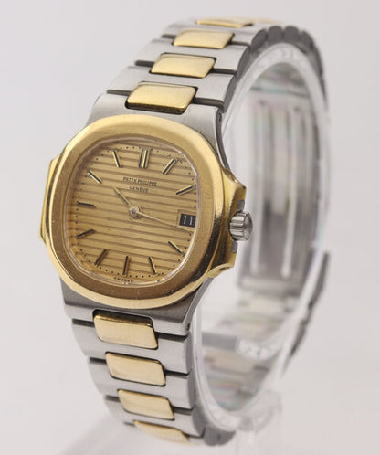 Patek Philippe Ladies 4700 Nautilus 27mm Steel and Gold Quartz Watch, golden champagne face, date aperture at 3, Steel and gold bracelet