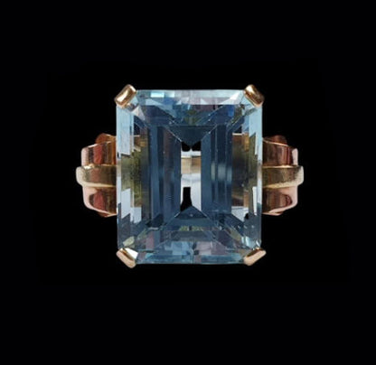 Vintage 18.50ct Aquamarine Cocktail Ring in Bi Colour Gold; large 18.50 carat emerald-cut aquamarine set in red and yellow gold with scroll shoulders, American, Circa 1930