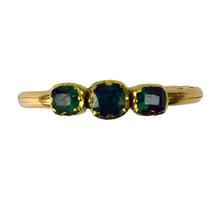 Antique Emerald Gimmel Fede Trinity Ring; comprising of three hinged parts, each set with a collet set step cut green emerald, come together to form a trinity set when the ring is closed, 18ct yellow gold, Circa 1809-1819