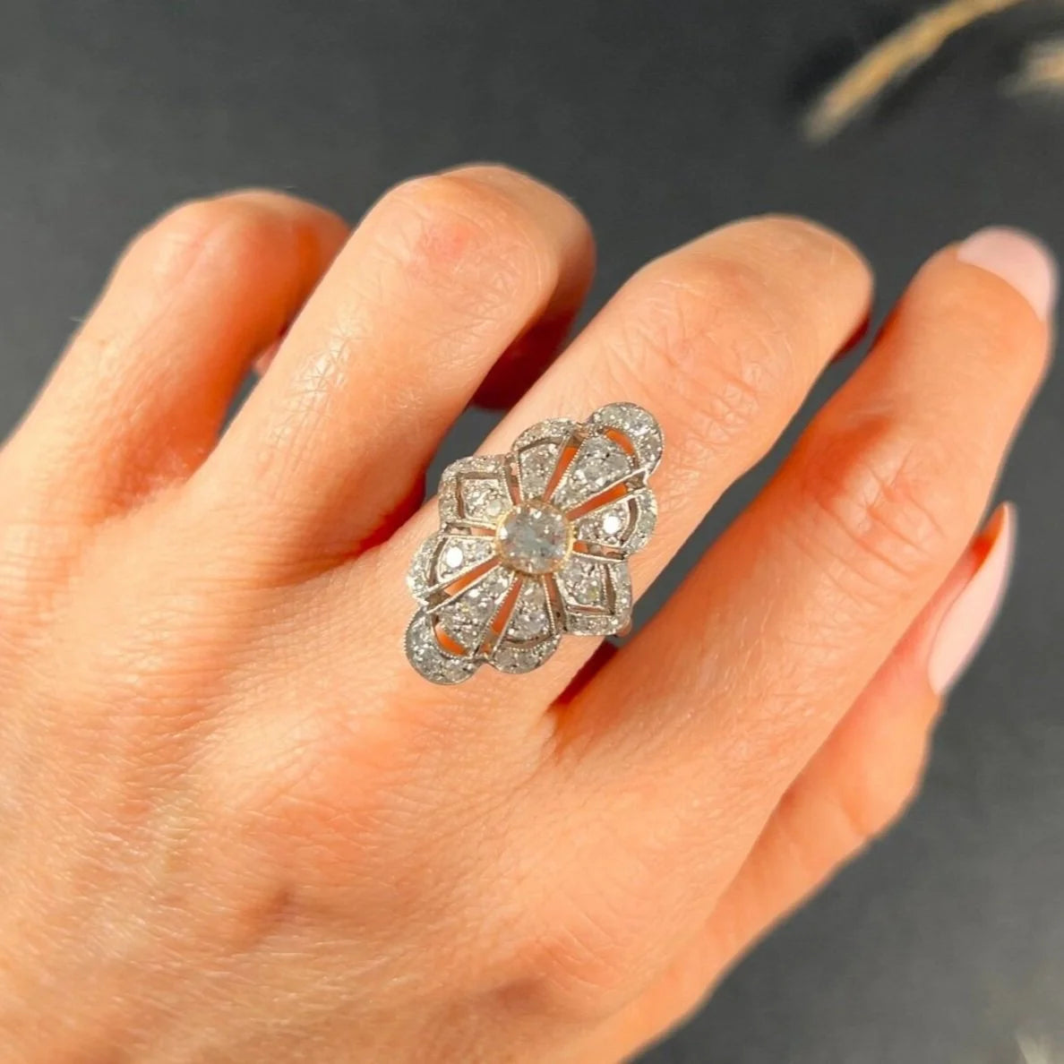 A diamond cocktail ring in white metal, modelled on a hand