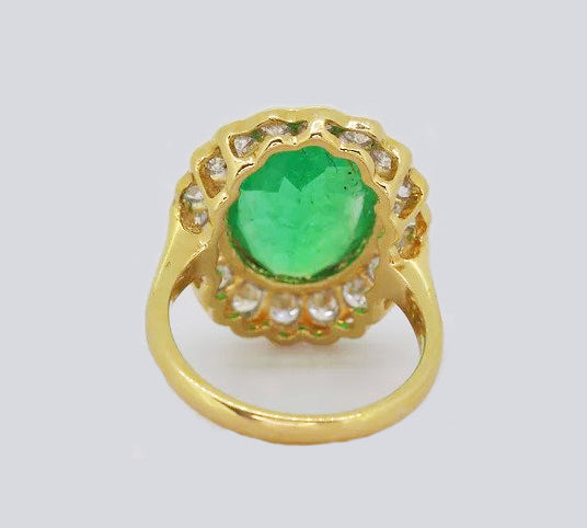 5.14ct Emerald and Diamond Oval Cluster Ring, in 18ct yellow gold.