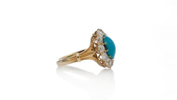 Antique Victorian Turquoise and Old Cut Diamond Cluster Ring; central 2.50ct round cabochon cut turquoise surrounded by 1.65cts old cut diamonds, in 15ct yellow gold, Circa 1870s