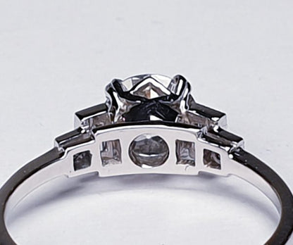 Vintage 1.06ct Old Cut Diamond and Platinum Engagement Ring; featuring a 1.06 carat G colour VS1 clarity old European transitional cut diamond with baguette and radiant-cut diamond shoulders, in platinum