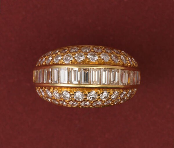 Vintage 3.20ct Diamond Bombe Dress Ring; set with a band of baguette-cut diamonds, surrounded by brilliant cut diamonds, 18ct yellow gold