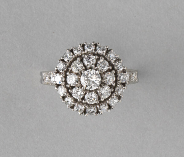 Tiffany and Co Vintage 1.75ct Diamond and Platinum Circular Cluster Ring; central 0.25ct brilliant-cut diamond stone is surrounded by two halos of diamonds, diamond set shoulders, in platinum and iridium, Signed, Circa 1950