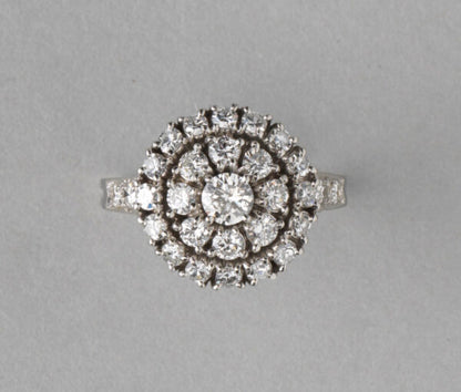 Tiffany and Co Vintage 1.75ct Diamond and Platinum Circular Cluster Ring; central 0.25ct brilliant-cut diamond stone is surrounded by two halos of diamonds, diamond set shoulders, in platinum and iridium, Signed, Circa 1950