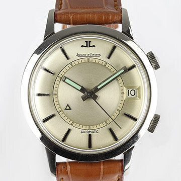 Vintage Jaeger LeCoultre Memovox Alarm 37mm Stainless Steel Automatic Watch, silver dial with date indicator and alarm function, on a brown leather strap with Jaeger-LeCoultre steel pin buckle, Circa 1950s