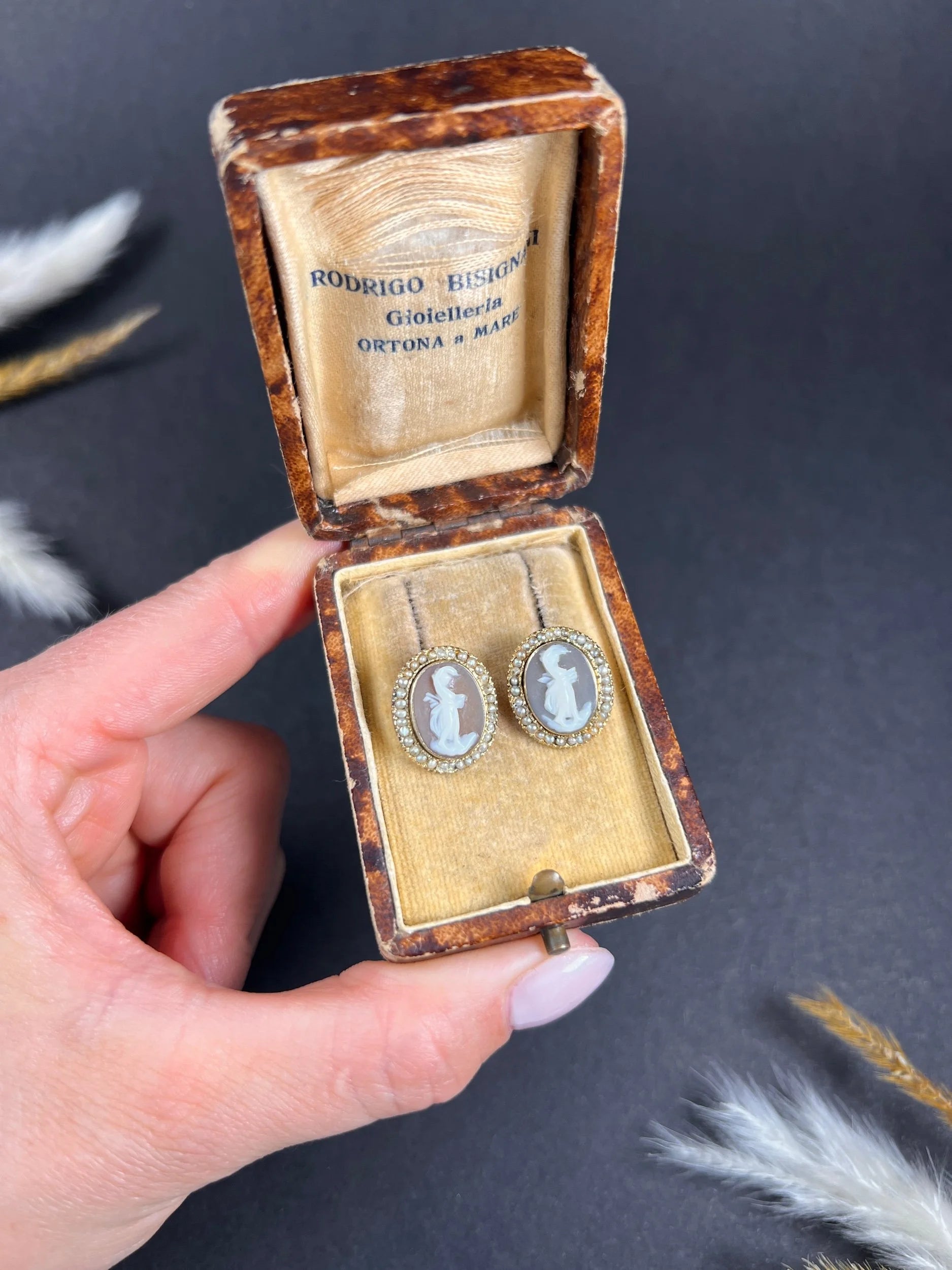 A pair of yellow gold oval shell cameo earrings, in an antique box