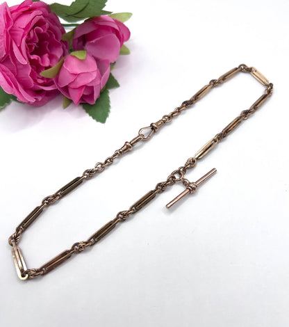 A rose gold fancy link Albert chain necklace