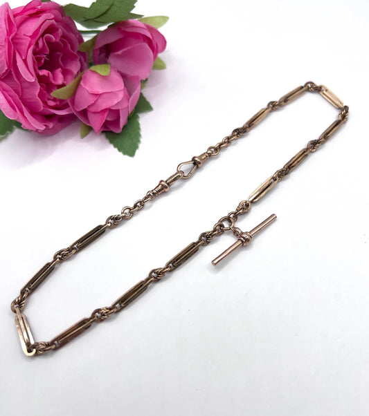 A rose gold fancy link Albert chain necklace