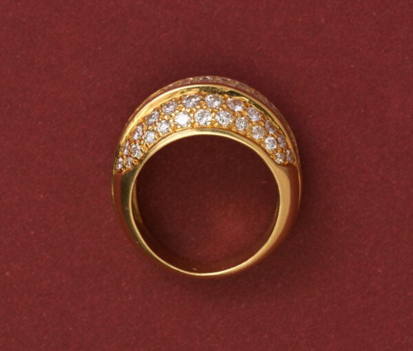 Vintage 3.20ct Diamond Bombe Dress Ring; set with a band of baguette-cut diamonds, surrounded by brilliant cut diamonds, 18ct yellow gold