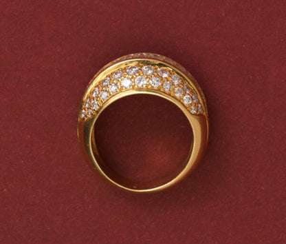 Vintage 3.20ct Diamond Bombe Dress Ring; set with a band of baguette-cut diamonds, surrounded by brilliant cut diamonds, 18ct yellow gold