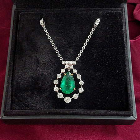 4.85ct Pear Cut Emerald and Diamond Cluster Pendant on Diamond Set Chain