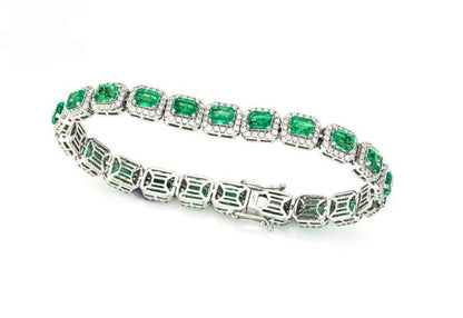 Colombian Emerald and Diamond Cluster Bracelet; featuring 9.02cts emerald-cut emeralds and 3.00cts brilliant cut diamonds, in 14ct White Gold