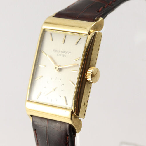 Patek Philippe Vintage Rectangular 18ct Yellow Gold Manual Watch, Ref 1531, silver dial, small seconds subdial at 6, Patek Philippe brown leather strap, with service papers, Circa 1940-50s
