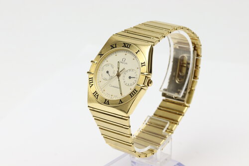 Omega Constellation Day Date 18ct Yellow Gold 33mm Quartz Watch, white dial with weekday and date sub-dials, black Roman numerals, yellow gold bezel, 18ct yellow gold bracelet with matching 18ct push-button clasp.