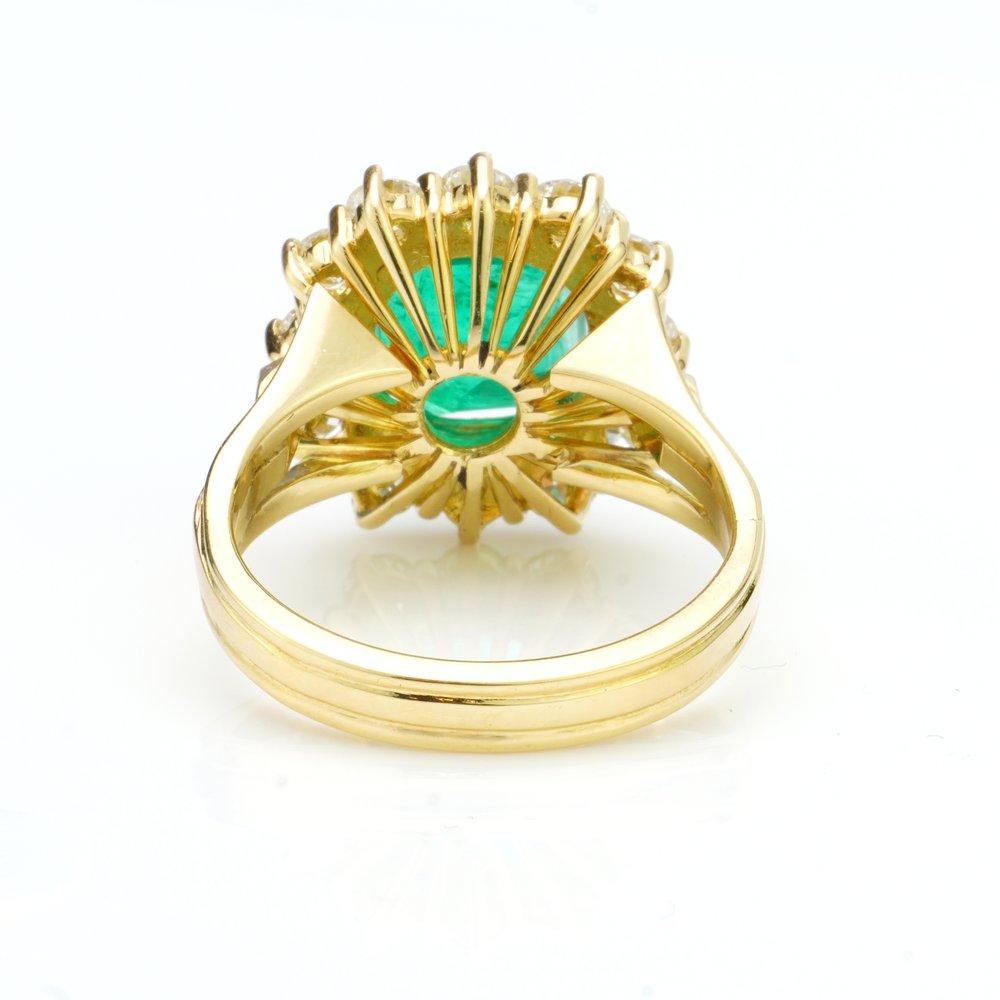 3.80ct Emerald Cut Emerald and Diamond Cluster Ring, in 18ct yellow gold with triple-split shoulders