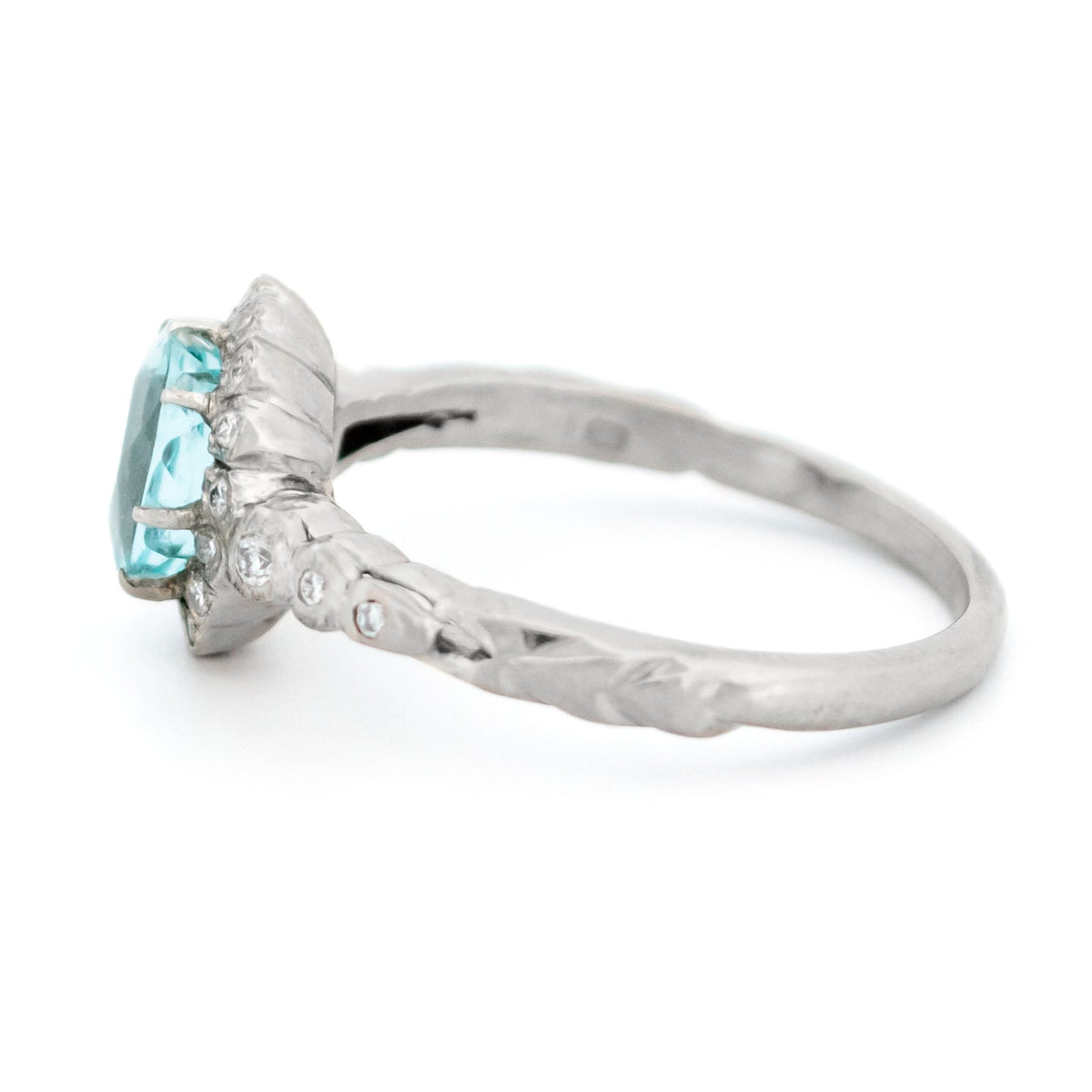 An oval aquamarine and round diamond cluster ring in white gold