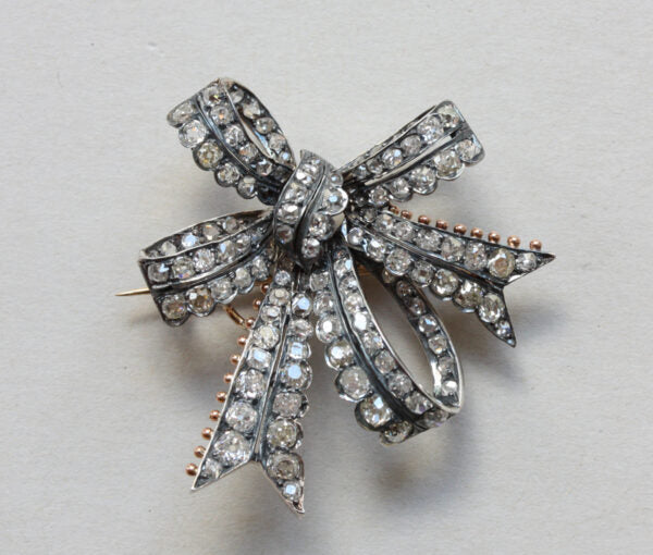 Antique Victorian Old Cut Diamond Double Bow Brooch, 3.40 carat total, set in silver and backed with gold, England, Circa 1880.