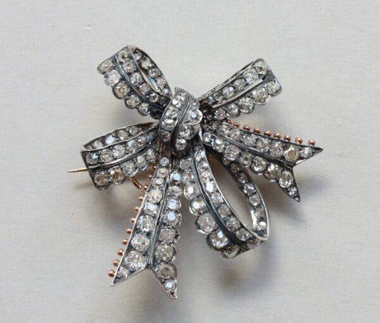 Antique Victorian Old Cut Diamond Double Bow Brooch, 3.40 carat total, set in silver and backed with gold, England, Circa 1880.