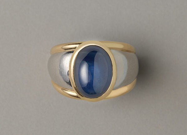 Vintage 11.87ct Cabochon Sapphire, Gold and Platinum Dress Ring; set with an oval cabochon-cut 11.87 carat natural untreated sapphire. France