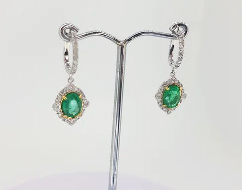 Emerald and Diamond Cluster Drop Earrings; 2.21cts oval emeralds surrounded by brilliant diamonds, suspended from diamond set hoop, 18ct gold
