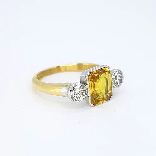 2.25ct Emerald Cut Yellow Sapphire and Diamond Three Stone Ring, on an 18ct yellow gold shank