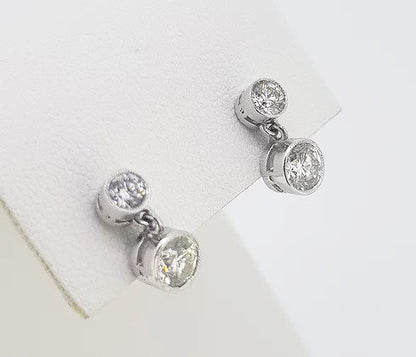 1.10ct Diamond Drop Earrings; featuring brilliant cut diamonds suspended from a diamond set stud, 1.10 carat total, in 18ct white gold