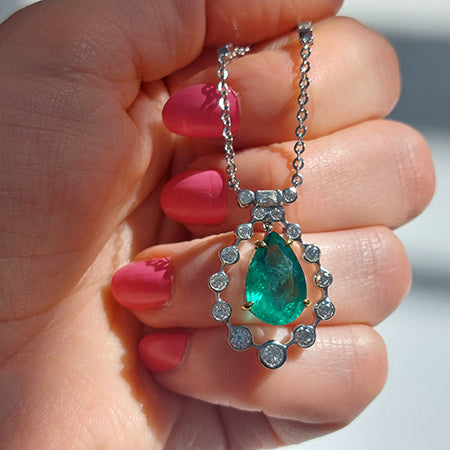 4.85ct Pear Cut Emerald and Diamond Cluster Pendant on Diamond Set Chain