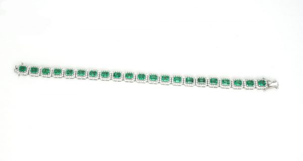 Colombian Emerald and Diamond Cluster Bracelet; featuring 9.02cts emerald-cut emeralds and 3.00cts brilliant cut diamonds, in 14ct White Gold