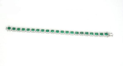 Colombian Emerald and Diamond Cluster Bracelet; featuring 9.02cts emerald-cut emeralds and 3.00cts brilliant cut diamonds, in 14ct White Gold