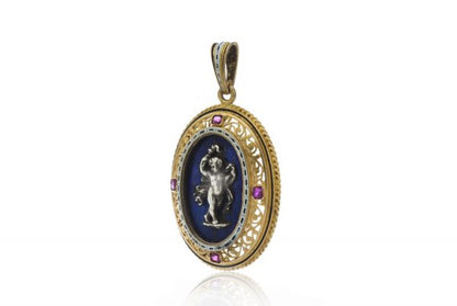 Antique Italian 18ct Yellow Gold Pendant in the style of Castellani; featuring a silver cherub on lapis lazuli, in 18ct pierced surround accented with rubies, Circa 1850-1870s