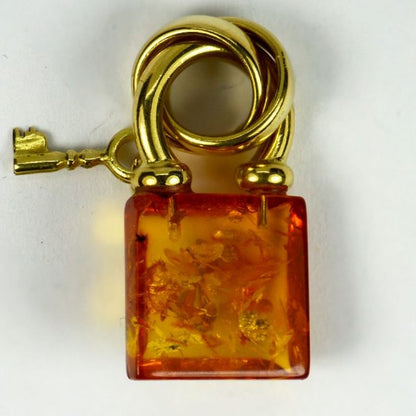 French Amber and 18ct Gold Padlock with Key Charm Pendant