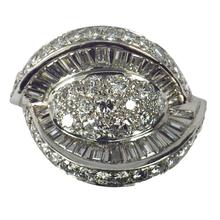 Retro Diamond and Platinum Cocktail Ring; designed as a dome with curved and flaring ridges, set with 2.55 carats round brilliant cut and baguette diamonds