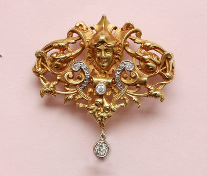 Antique Edwardian Diamond Set 18ct Yellow Gold Neo Renaissance Brooch; openwork Mascaron, scroll, foliate and floral design, Circa 1890.