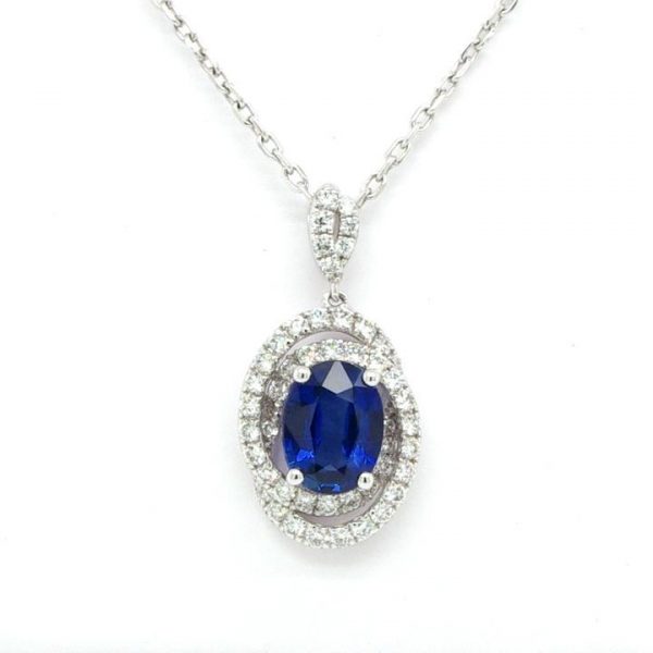 1.36ct Oval Sapphire and Diamond Swirl Cluster Pendant in 18ct White Gold