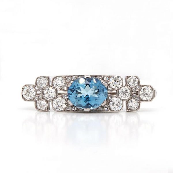 Art Deco Aquamarine, Diamond and Platinum Brooch; vibrant blue oval-cut aquamarine surrounded by 2.50cts old-cut diamonds. Mounted in platinum.