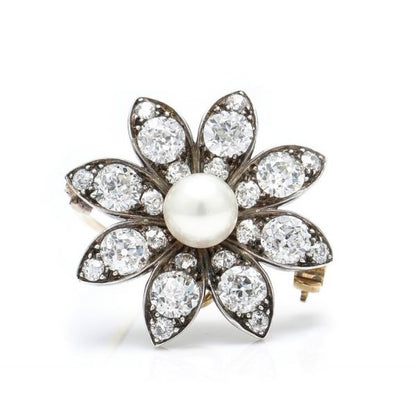 Antique Victorian Freshwater Pearl and Old Cut Diamond Flower Brooch Pendant; central freshwater pearl beautifully accented with 3.28cts of diamond-set petals, in silver and 18ct yellow gold. Made in England, late 19th century, Circa 1880s