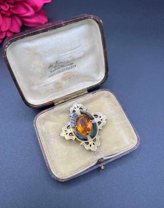 A yellow gold, oval citrine and agate ornate brooch, in an antique box